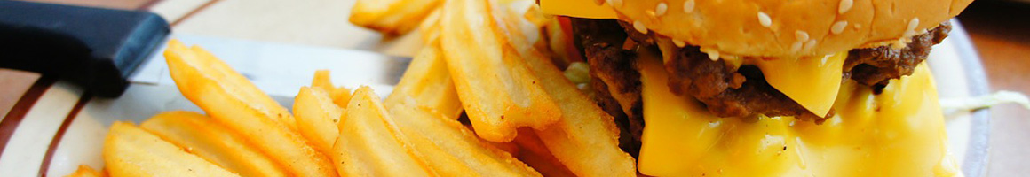 Eating American (Traditional) Burger at Skyway Drive-In restaurant in Akron, OH.